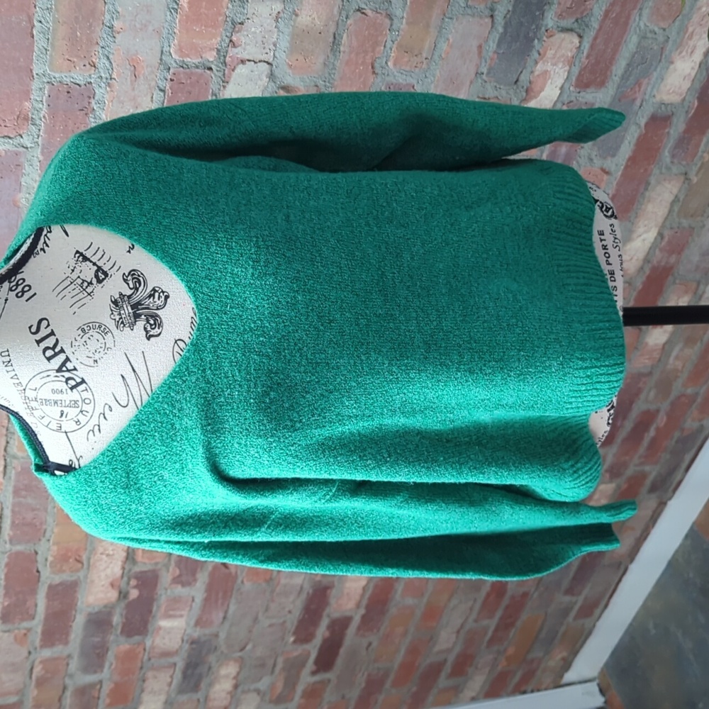 Green sweater.